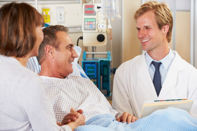 Doctor Talking To Couple On Ward